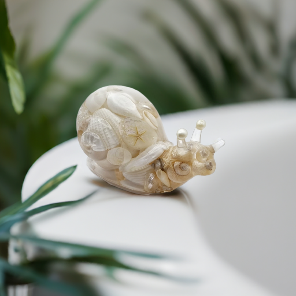 Handcrafted Resin Snail Figurine Featuring White Seashells