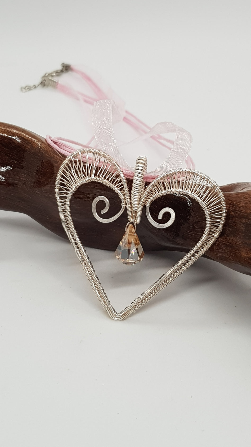 Handcrafted Silver Wire Wrapped Woven Love Heart Pendant Featuring A Faceted Crystal Bead