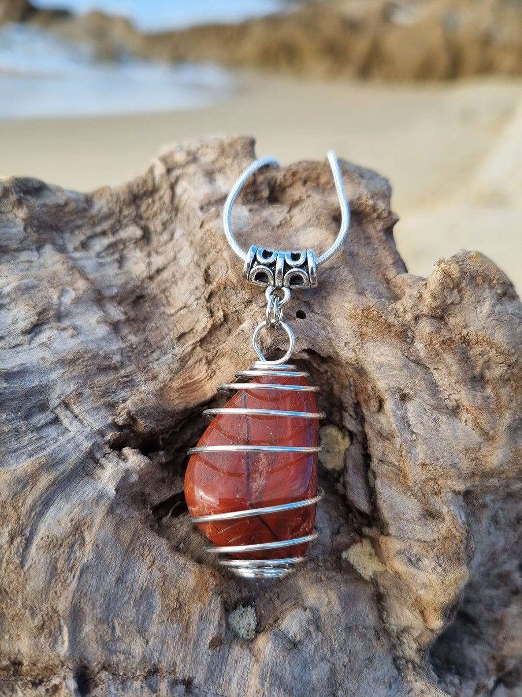 'Anadara' Polished Beach Stone Caged Pendants