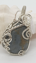 Load image into Gallery viewer, Silver Swirly Tumbled Blue Beach Stone Pendant
